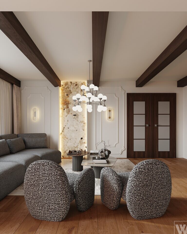Strefa wypoczynkowa salonu modern classic z designerskimi fotelami i stolikami kawowymi